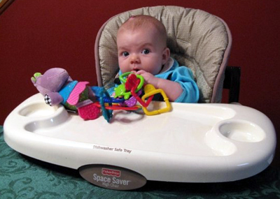 Katie in her high chair for the first time