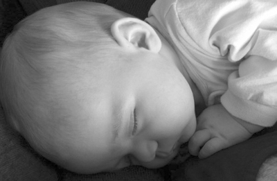 Katie asleep in Mommy's arms