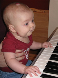 Kathleen playing the piano (4 months)